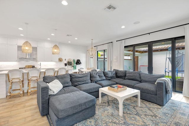 13291 Machiavelli Way, Palm Beach Gardens, FL 33418 - living room with light wood-style floors and recessed lighting