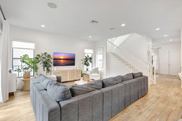 13291 Machiavelli Way, Palm Beach Gardens, FL 33418 - living room with stairway, light wood finished floors, recessed lighting, and baseboards