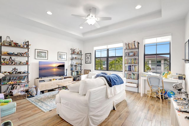 13291 Machiavelli Way, Palm Beach Gardens, FL 33418 - living room featuring a tray ceiling, light wood-style floors, ceiling fan, and recessed lighting