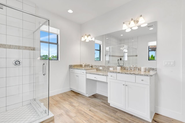 13291 Machiavelli Way, Palm Beach Gardens, FL 33418 - bathroom featuring a shower stall, baseboards, vanity, wood finished floors, and recessed lighting