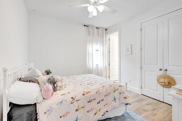 13291 Machiavelli Way, Palm Beach Gardens, FL 33418 - bedroom featuring light wood finished floors, a ceiling fan, and a closet