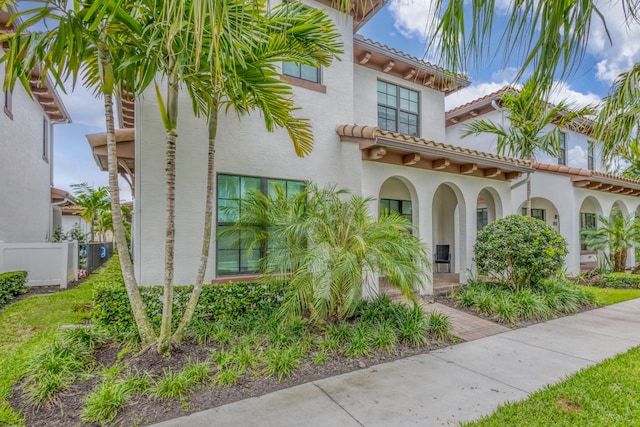 13291 Machiavelli Way, Palm Beach Gardens, FL 33418 - view of front facade with stucco siding and a tiled roof