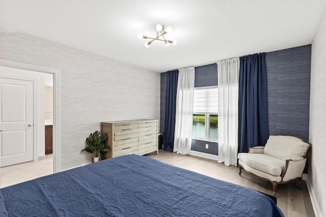 587 Sanderling Cir, Deerfield Beach, FL 33442 - bedroom with a chandelier and light wood-style flooring