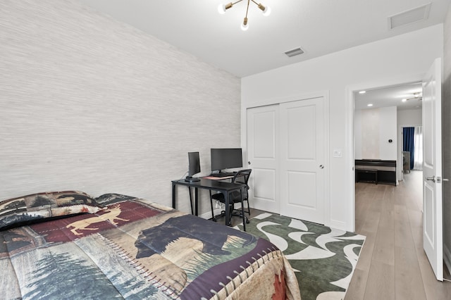 587 Sanderling Cir, Deerfield Beach, FL 33442 - bedroom with a closet, wood finished floors, and a desk