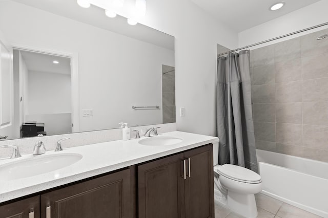 587 Sanderling Cir, Deerfield Beach, FL 33442 - bathroom featuring double vanity, toilet, tile patterned floors, and shower / bathtub combination with curtain