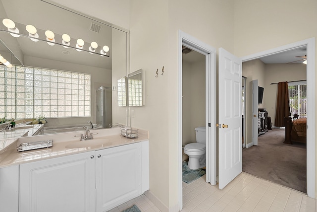 7591 NW 29th St, Margate, FL 33063 - ensuite bathroom with tile patterned flooring, vanity, toilet, a shower stall, and baseboards