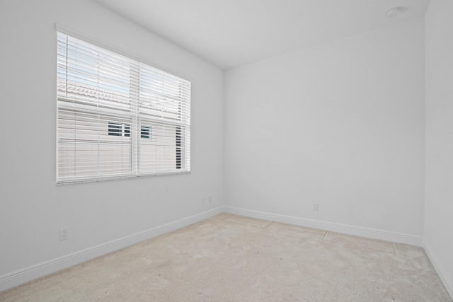 24038 SW Firenze Way, Port Saint Lucie, FL 34986 - unfurnished room with light colored carpet, baseboards, and a smoke detector