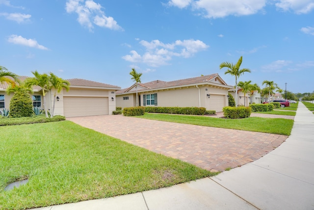 24038 SW Firenze Way, Port Saint Lucie, FL 34986 - single story home with a garage, decorative driveway, a front yard, and stucco siding