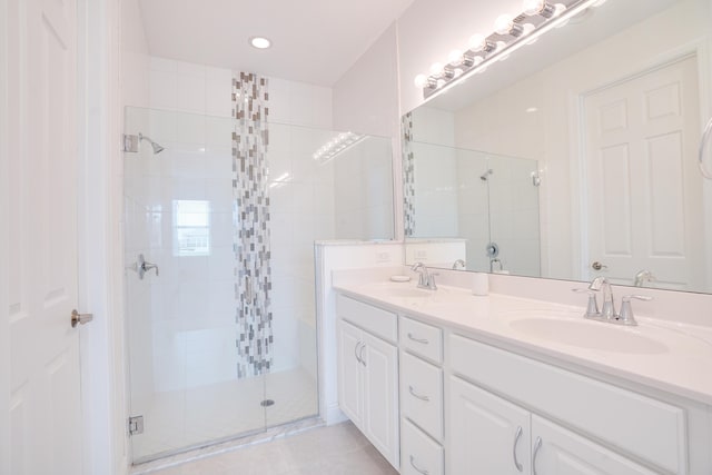 24038 SW Firenze Way, Port Saint Lucie, FL 34986 - full bathroom featuring a stall shower, double vanity, tile patterned flooring, and recessed lighting