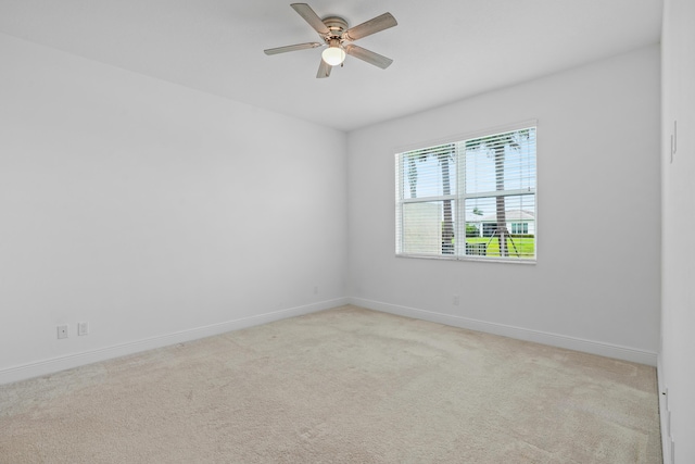 24038 SW Firenze Way, Port Saint Lucie, FL 34986 - spare room with baseboards, light colored carpet, and ceiling fan
