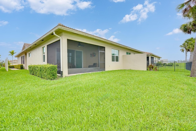 24038 SW Firenze Way, Port Saint Lucie, FL 34986 - rear view of house with a sunroom and stucco siding