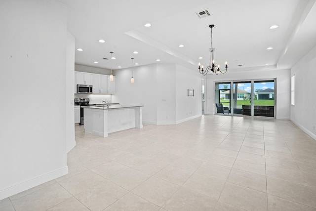 24038 SW Firenze Way, Port Saint Lucie, FL 34986 - unfurnished living room featuring recessed lighting, a chandelier, light tile patterned flooring, a sink, and baseboards