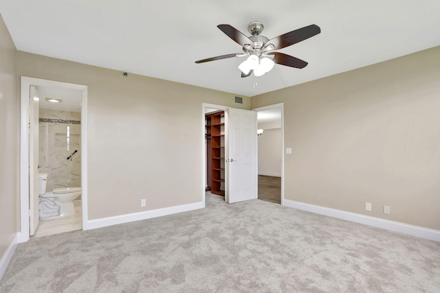 2430 Deer Creek Country Club Blvd Unit 205-2, Deerfield Beach, FL 33442 - unfurnished bedroom with a spacious closet, carpet, a closet, and ensuite bathroom