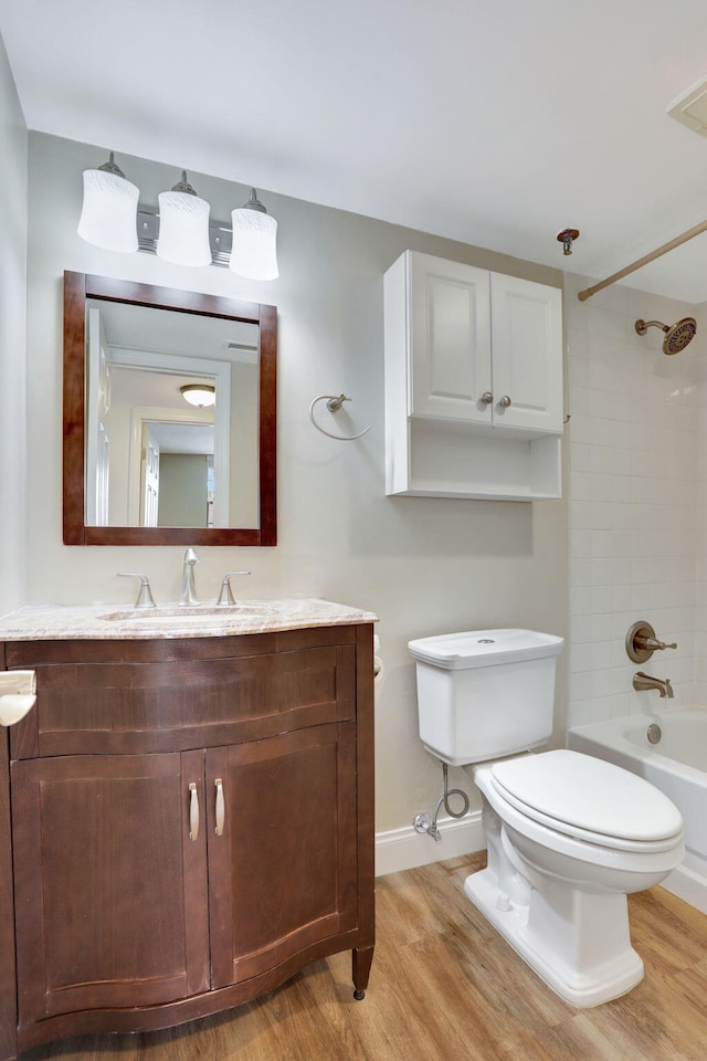 2430 Deer Creek Country Club Blvd Unit 205-2, Deerfield Beach, FL 33442 - full bathroom featuring vanity, wood finished floors, and bathing tub / shower combination