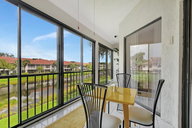 5419 Firenze Dr Unit K, Boynton Beach, FL 33437 - sunroom / solarium with tile patterned floors, a water view, a textured wall, and a residential view