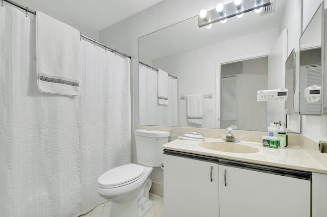 5419 Firenze Dr Unit K, Boynton Beach, FL 33437 - bathroom featuring toilet, vanity, and tile patterned flooring