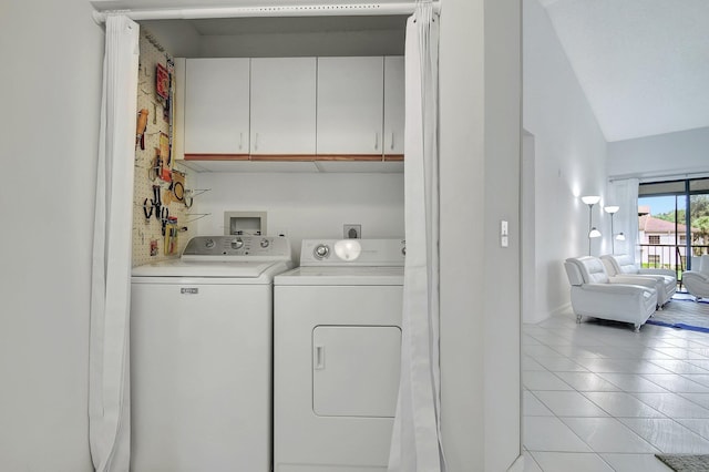 5419 Firenze Dr Unit K, Boynton Beach, FL 33437 - laundry room featuring washing machine and clothes dryer, cabinet space, light tile patterned floors, and baseboards
