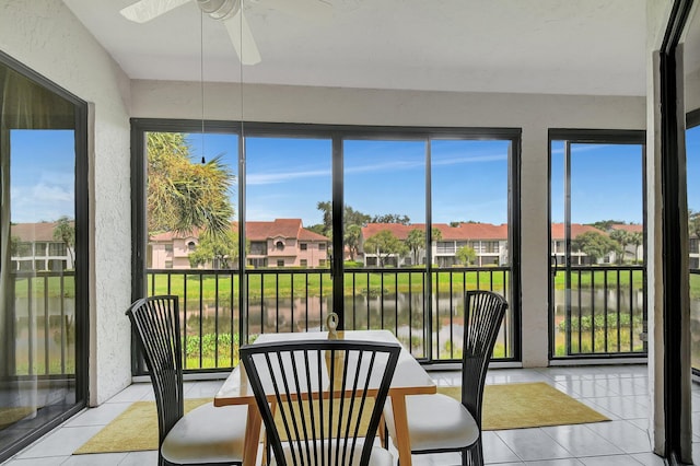 5419 Firenze Dr Unit K, Boynton Beach, FL 33437 - sunroom / solarium with tile patterned floors, a water view, a residential view, healthy amount of natural light, and a textured wall