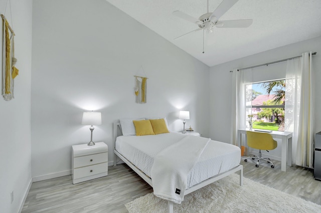 5419 Firenze Dr Unit K, Boynton Beach, FL 33437 - bedroom with wood finished floors, lofted ceiling, a desk, baseboards, and ceiling fan