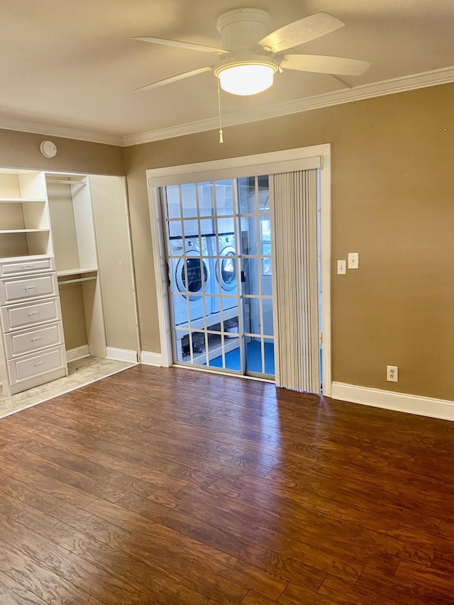 294 Brittany Unit G, Delray Beach, FL 33446 - spare room with ceiling fan, ornamental molding, wood finished floors, washer / clothes dryer, and a smoke detector