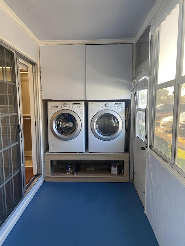 294 Brittany Unit G, Delray Beach, FL 33446 - washroom featuring washer and clothes dryer, crown molding, and plenty of natural light