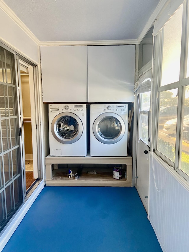 294 Brittany Unit G, Delray Beach, FL 33446 - laundry area featuring separate washer and dryer, crown molding, carpet, and plenty of natural light
