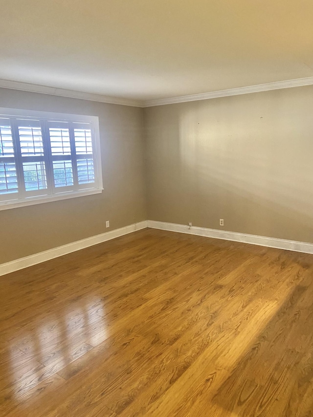 294 Brittany Unit G, Delray Beach, FL 33446 - empty room with ornamental molding and wood finished floors