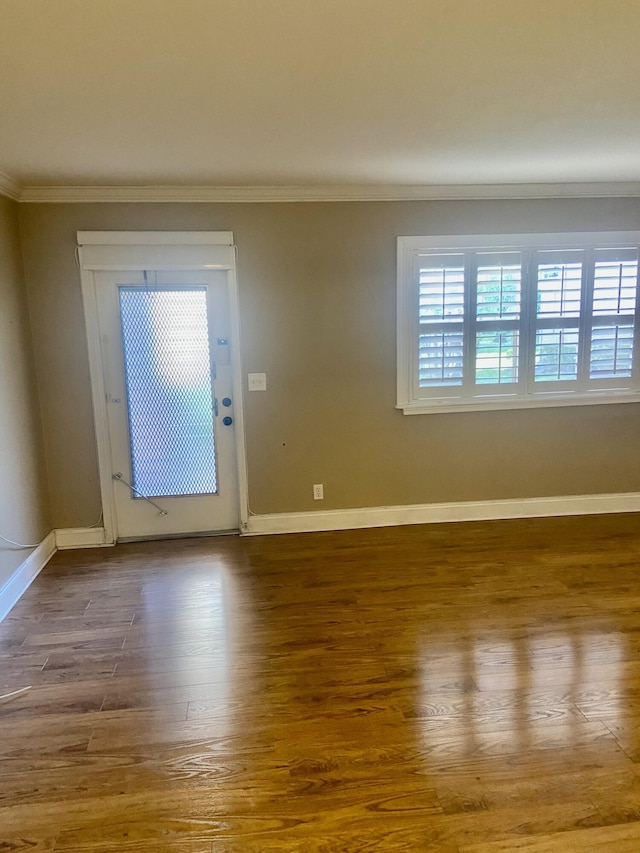 294 Brittany Unit G, Delray Beach, FL 33446 - empty room with ornamental molding and wood finished floors