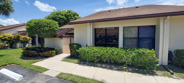 3710 English Rd Unit A, Lake Worth, FL 33467 - property entrance featuring stucco siding