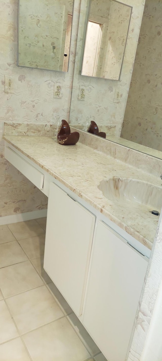 3710 English Rd Unit A, Lake Worth, FL 33467 - bathroom with wallpapered walls, vanity, and tile patterned flooring