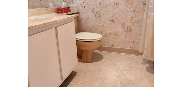 3710 English Rd Unit A, Lake Worth, FL 33467 - bathroom featuring vanity, toilet, and wallpapered walls