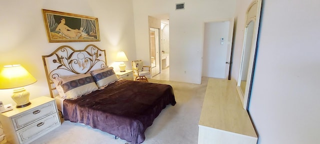 3710 English Rd Unit A, Lake Worth, FL 33467 - bedroom with light colored carpet and ensuite bathroom