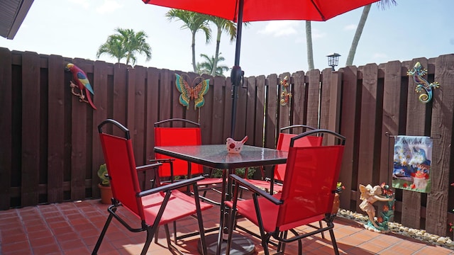 804 Sky Pine Way Unit C, Greenacres, FL 33415 - view of patio / terrace featuring outdoor dining area