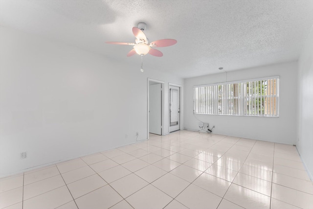 117 Lake Dora Dr, West Palm Beach, FL 33411 - unfurnished room with a ceiling fan, a textured ceiling, and light tile patterned floors