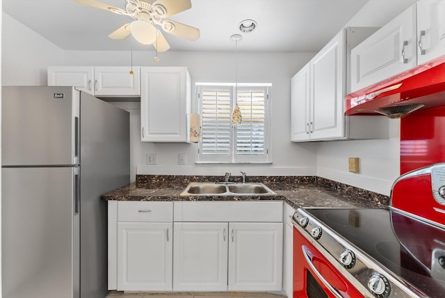 117 Lake Dora Dr, West Palm Beach, FL 33411 - kitchen with freestanding refrigerator, a sink, range, and white cabinetry