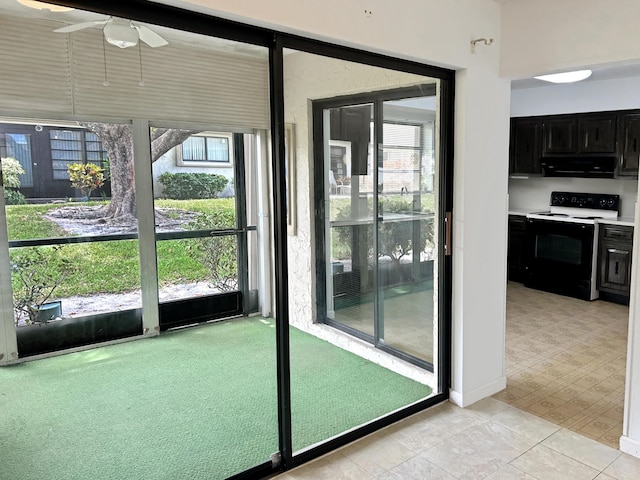 4940 Hawkwood Way Unit A, Boynton Beach, FL 33436 - entryway featuring ceiling fan, light colored carpet, and light tile patterned floors