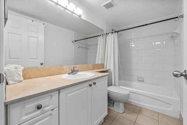 651 Okeechobee Blvd Unit 408, West Palm Beach, FL 33401 - bathroom featuring tile patterned flooring, vanity, shower / bath combo with shower curtain, and toilet