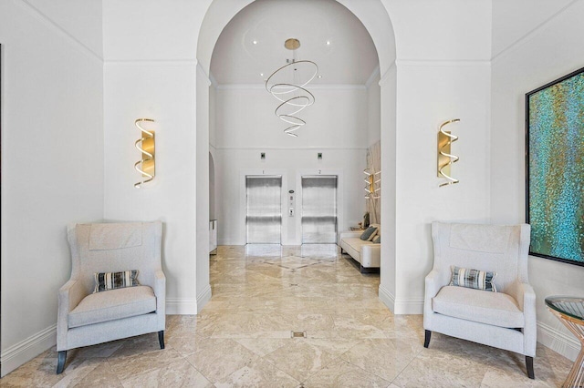 651 Okeechobee Blvd Unit 408, West Palm Beach, FL 33401 - sitting room featuring arched walkways, elevator, ornamental molding, marble tiled floors, and a towering ceiling