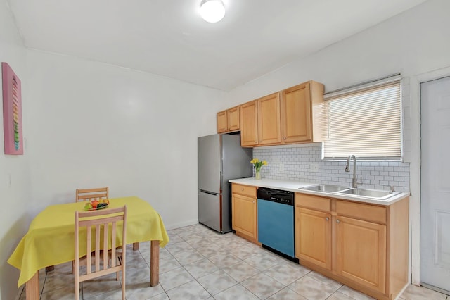 701 S J St, Lake Worth Beach, FL 33460 - kitchen with dishwashing machine, a sink, freestanding refrigerator, decorative backsplash, and light countertops