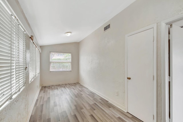 701 S J St, Lake Worth Beach, FL 33460 - unfurnished bedroom featuring light wood-style floors and lofted ceiling
