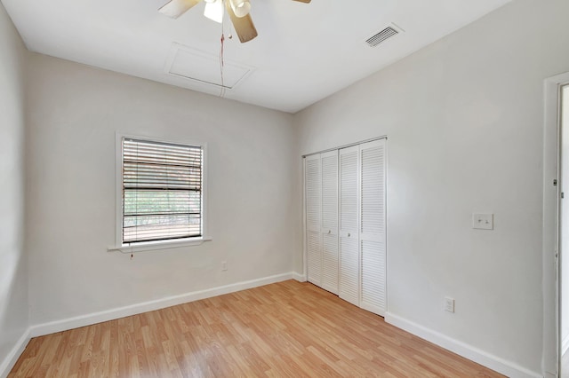 701 S J St, Lake Worth Beach, FL 33460 - unfurnished bedroom with wood finished floors, a closet, attic access, and baseboards
