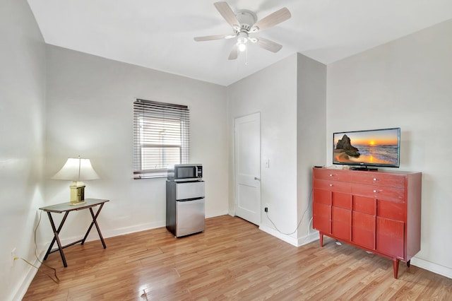 701 S J St, Lake Worth Beach, FL 33460 - unfurnished office featuring light wood-type flooring, a ceiling fan, and baseboards