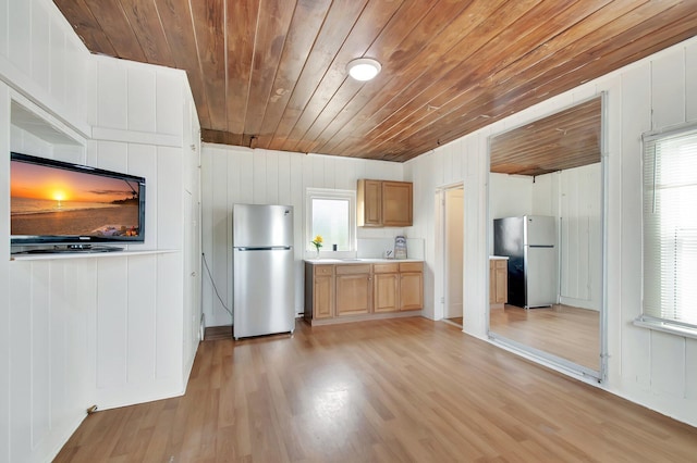 701 S J St, Lake Worth Beach, FL 33460 - kitchen with freestanding refrigerator, wood ceiling, light wood finished floors, light countertops, and plenty of natural light