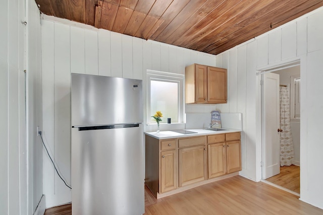 701 S J St, Lake Worth Beach, FL 33460 - kitchen featuring freestanding refrigerator, wood ceiling, light wood-style floors, light countertops, and a sink