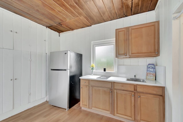 701 S J St, Lake Worth Beach, FL 33460 - kitchen with freestanding refrigerator, wood ceiling, a sink, light wood-type flooring, and light countertops