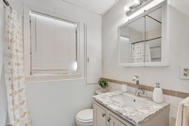 701 S J St, Lake Worth Beach, FL 33460 - full bath featuring vanity, toilet, and tile walls