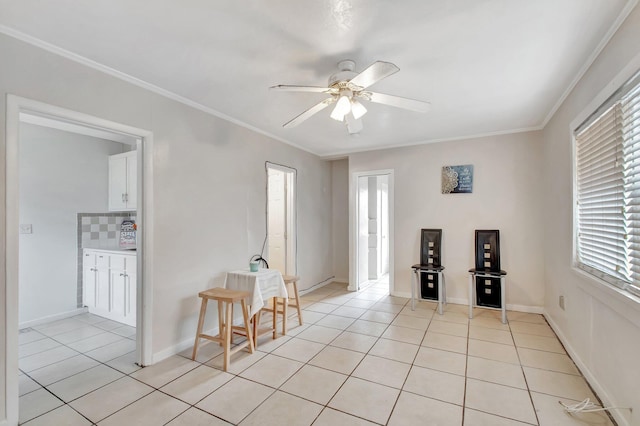 701 S J St, Lake Worth Beach, FL 33460 - empty room with light tile patterned floors, healthy amount of natural light, a ceiling fan, ornamental molding, and baseboards