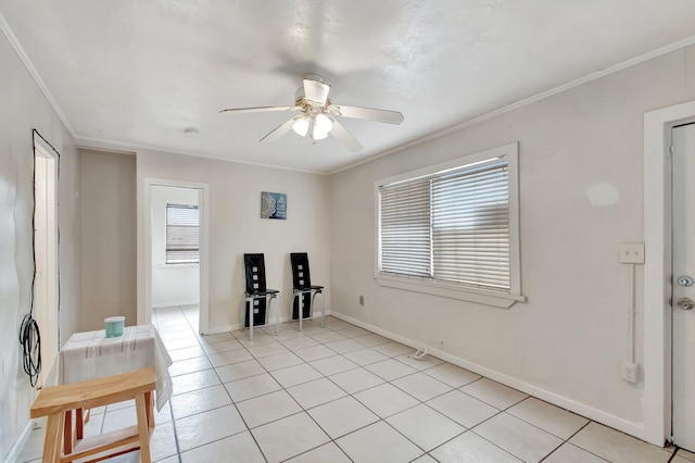 701 S J St, Lake Worth Beach, FL 33460 - spare room featuring a ceiling fan, crown molding, light tile patterned floors, and baseboards