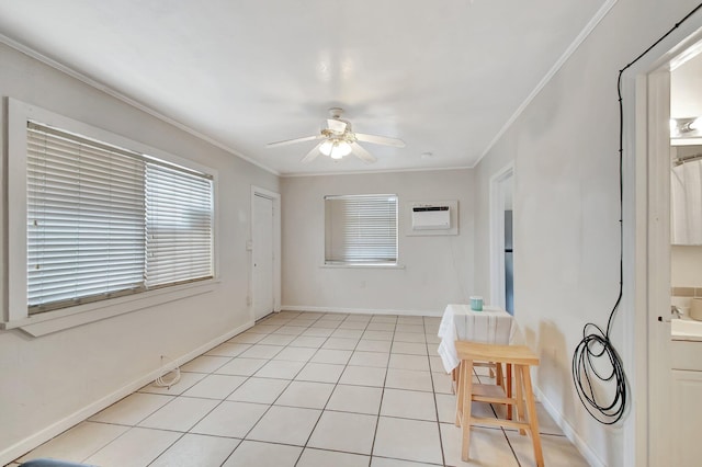 701 S J St, Lake Worth Beach, FL 33460 - unfurnished room with ceiling fan, ornamental molding, light tile patterned floors, a wall unit AC, and baseboards