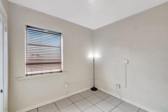 701 S J St, Lake Worth Beach, FL 33460 - unfurnished room with light tile patterned floors and baseboards